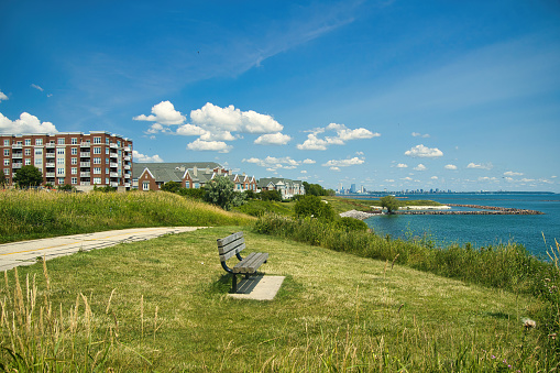 Beautiful Summer's day landscape of the Oak Leaf Recreational Trail passing condos along the Lake Michigan shoreline with Downtown Milwaukee visible in the distance.