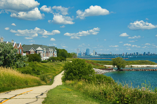 Beautiful Summer's day landscape of the Oak Leaf Recreational Trail passing condos along the Lake Michigan shoreline with Downtown Milwaukee visible in the distance.