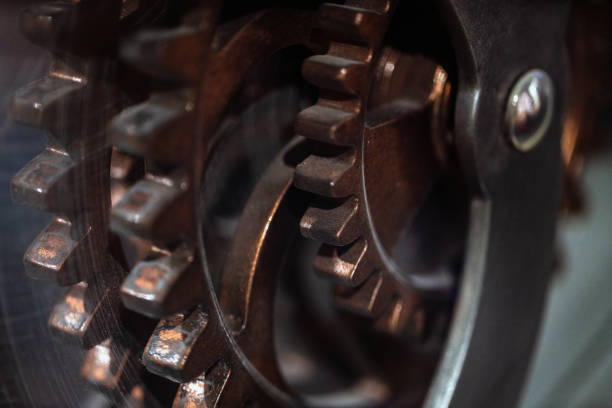 Brown vintage gear from old mechanism made of lumber rolling against while background