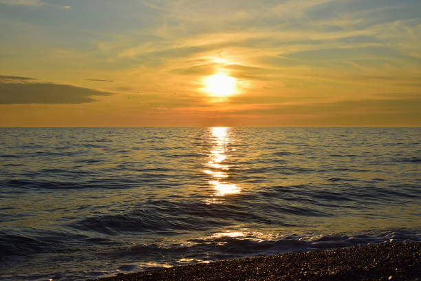 Beautiful sunset over the sea. Seascape. Marine background. Beauty of nature. Wallpaper, postcard.