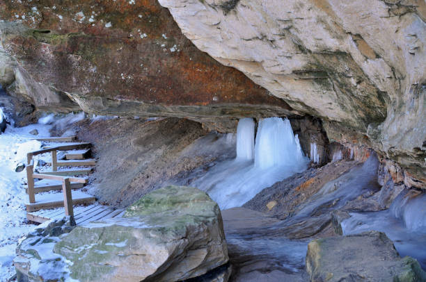 Turkey Run State Park is in Parke County Indiana.  Sandstone hollows were formed many years ago, making the park a paradise for hikers.  The tall colorful hollows make you feel like you are in another planet.  Waterfalls, cliffs, and hardwood forest are unique.  We have hiked every trail, many times and are always mesmerized by the magnificent rock walls.   Trail 3 is our favorite, but make sure you don't wear sandals.  The rock cliffs are slippery and you will get your feet wet because you walk along a creek bed and up a waterfall.  After the waterfall the trail takes you up a rock ledge with carefully carved steps requiring you to wait for oncoming hikers.