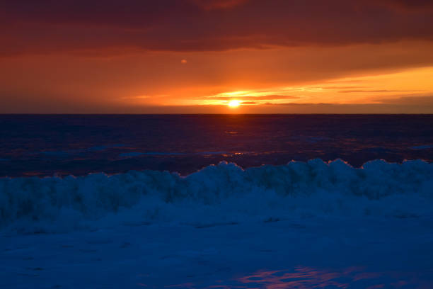 Big waves on the sea at sunset. Beautiful seascape. The sea is stormy.