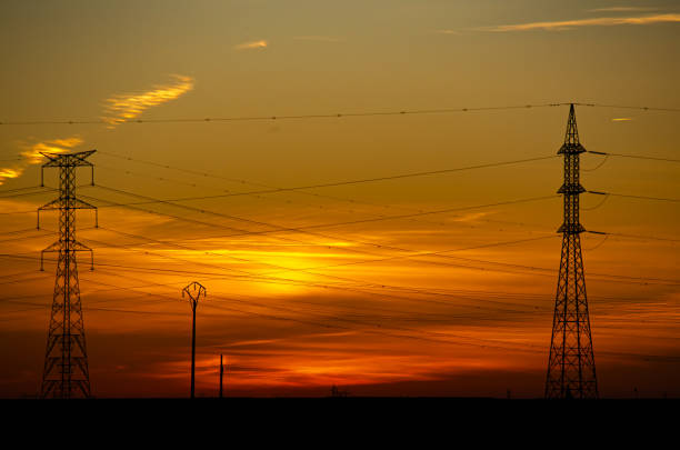 Tendidos electricos de alta tensión en un paisaje al atardecer en la provincia de Valladolid. November 18, 2023.