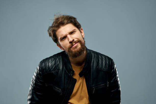 cute bearded man musician leather jacket attractive look lifestyle. High quality photo