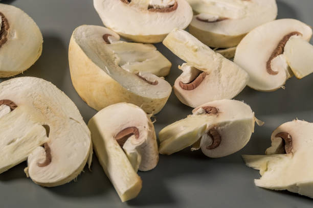 istock A close up of sliced mushrooms on a grey surface 2102096238