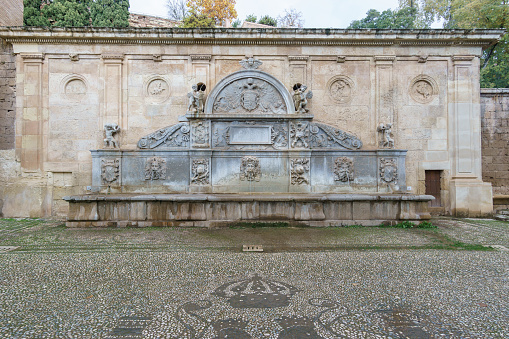 Fountain Pilar de Carlos V next to the Puerta de la Justicia of Alhambra, Granada, Andalusia, Spain