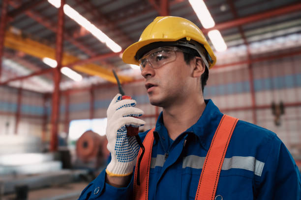 istock Team of engineers or workers getting safety suits and helmet. 2102120194