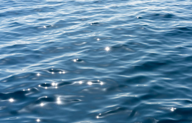 istock Sunlight sparkles on calm sea 2102155530