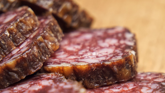 Sliced smoked sausage, macrophoto. Lots of sausage slices.