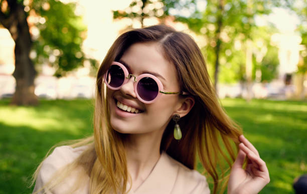 istock cheerful woman nature rest green grass fun 2102176957