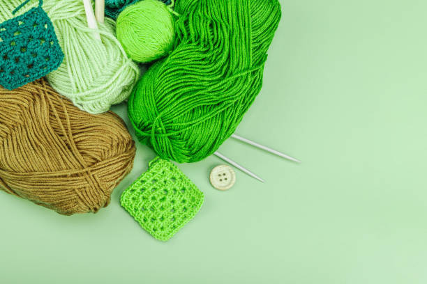 istock A set of knitting yarn and tools in spring colors. Handmade concept, creative art, crafting process 2102185365