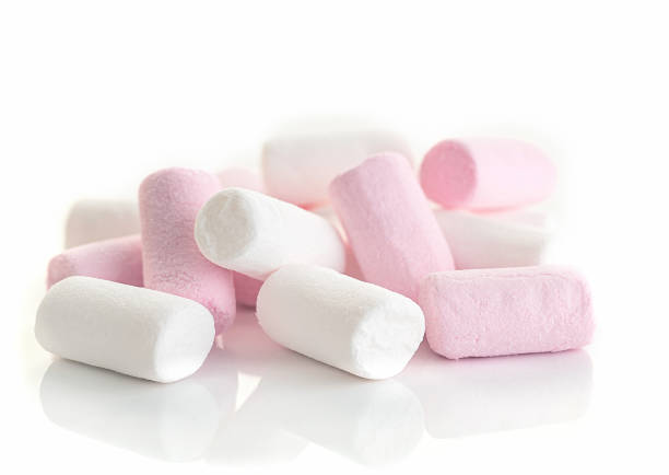 istock Heap of white and pink puffy marshmallow on white background. 2102201189