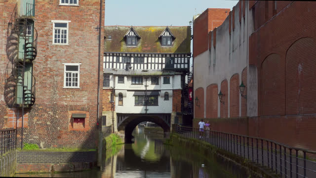 Footage of the waterfront area district of the ancient and historic city of Lincoln, Showing medieval streets and buildings.