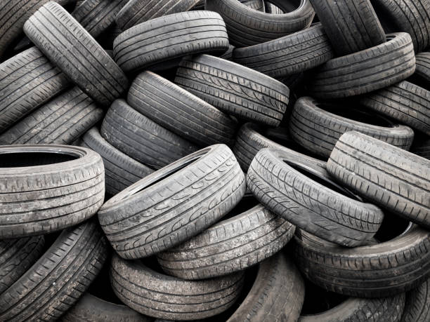 istock Pile Of Used Tyres 2102228831