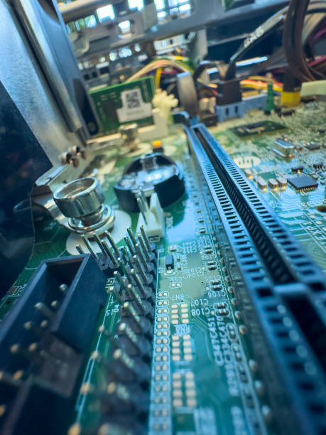 istock Close up of circuit board with microchips and other computer parts. Cables and Circuitry 2102238300