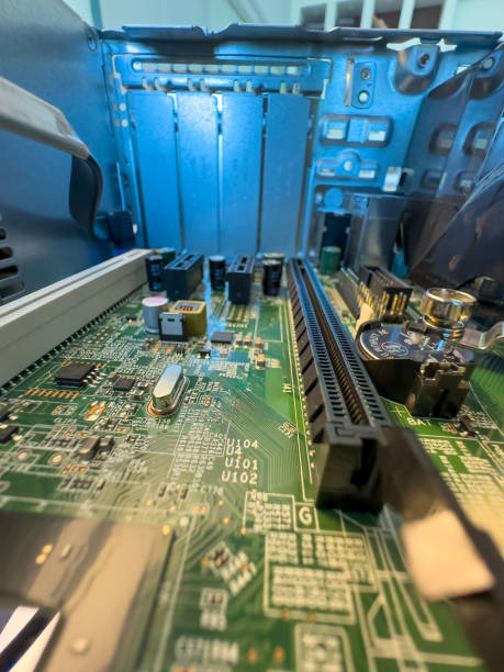 istock Close up of circuit board with microchips and other computer parts 2102240366