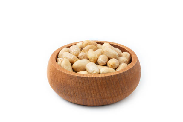istock Peanut in wooden bowl isolated on white background. 2102250181
