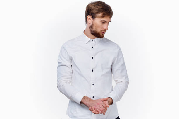 business man in white shirt gesturing with hands on light background cropped view. High quality photo