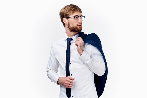 businessman in a classic suit with a tie around his neck and glasses on his face . High quality photo
