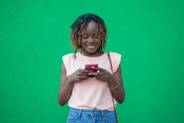 istock A smiling woman reads a message on her phone. Positive emotions. Technologies 2102304213