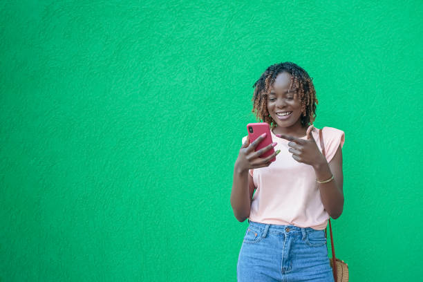 istock A smiling woman is talking on the phone. Positive emotions. Copy space 2102304215