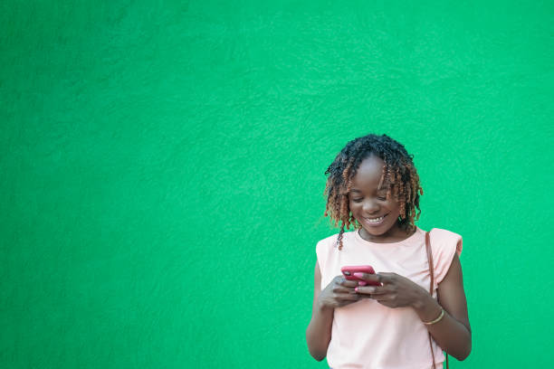 istock A smiling woman is talking on the phone. Positive emotions. Copy space 2102304219