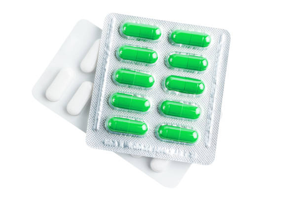 istock Various medicine capsules, pills and tablets in a blister pack isolated on white background, healthcare and medicine concept, top view 2102305268