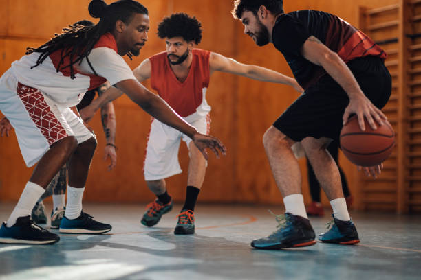 istock Multicultural basketball players in action practicing basketball. 2102343354