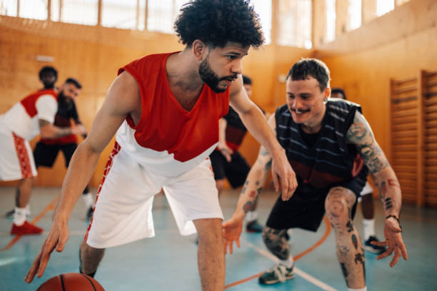 istock Interracial basketball players playing basket on training. 2102343361