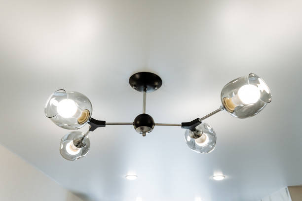 istock Artistic ceiling fixture, a chandelier hangs elegantly from above in a room 2102354491