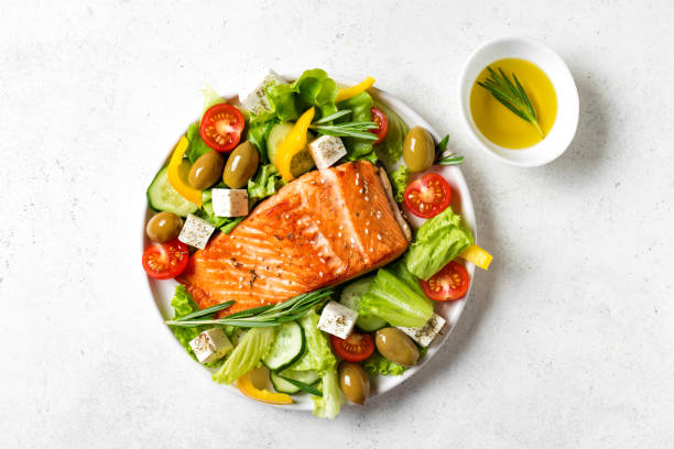 istock Grilled salmon steak and greek salad 2102358823