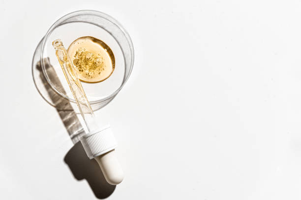 istock dropper with pouring retinol face serum 2102364959