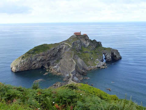 View of the Gaztelugatxe islet. Hermitage of San Juan. Connected to the mainland by a bridge. Coast of Biscay belonging to the municipality of Bermeo, Basque Country.