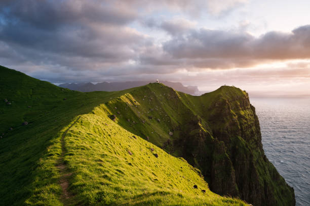 istock Kallur Lighthouse on Kalsoy Island, Faroe Islands 2102398382