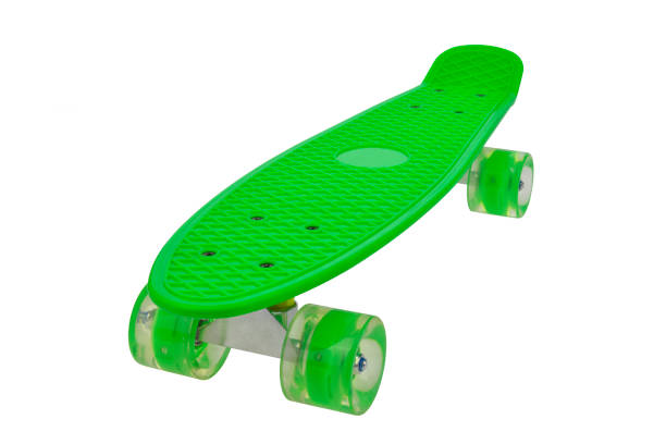 Green skateboard deck on white background stock photo