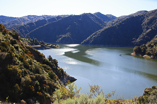 The scenic lake at near full capacity for the reservoir of Morris Dam along Highway 39 north of Azusa, California.