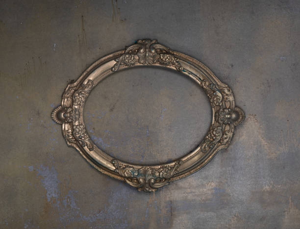 istock golden ancient dusty frame on a concrete wall 2102429702