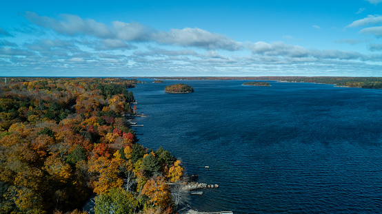 Aerial view of docks on the shoreline of Georgian Bay during the colorful fall