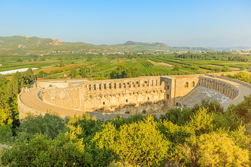 Aerial view of Roman Theatre in Aspendos in Turkey, well-preserved ruin of Roman engineering and architectural prowess. Built during Emperor Marcus Aurelius reign in 2nd century AD.