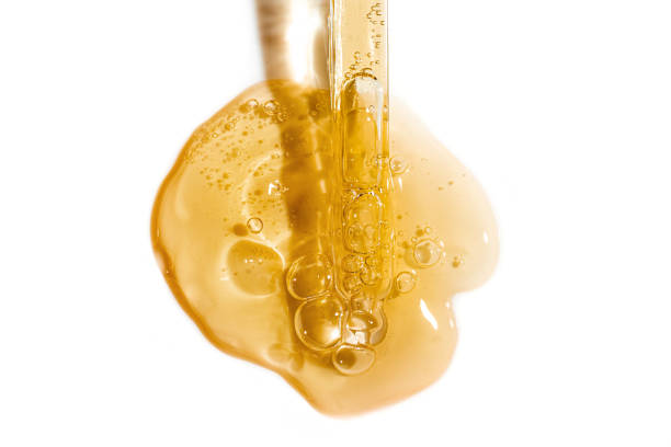 istock Dropper pipette and face serum texture 2102439122