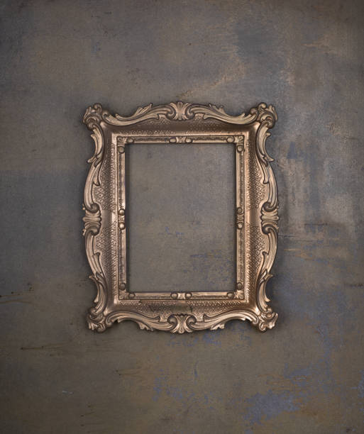istock golden ancient dusty frame on a concrete wall 2102441783
