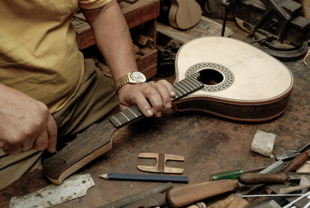 istock The handmade of a luthier of stringed musical instruments. 2102445953