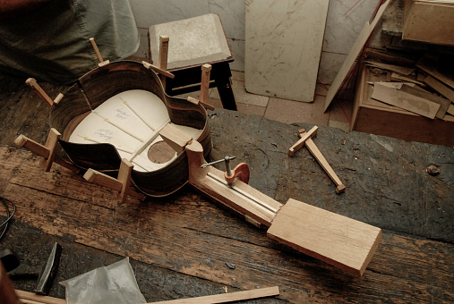 The handmade of a luthier of stringed musical instruments.