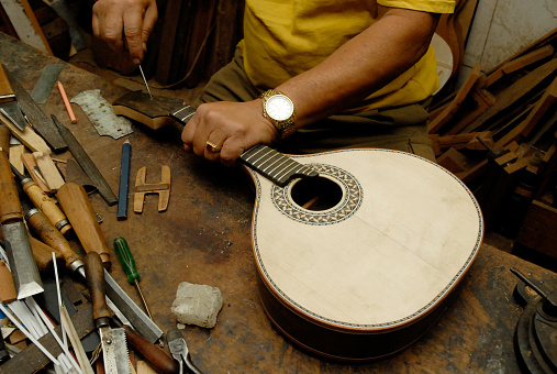 The handmade of a luthier of stringed musical instruments.