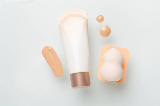 istock Composition with makeup foundation on color background, top view 2102488518