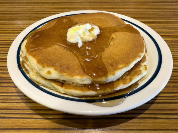 istock American style breakfast pancakes with maple syrup and butter 2102504309