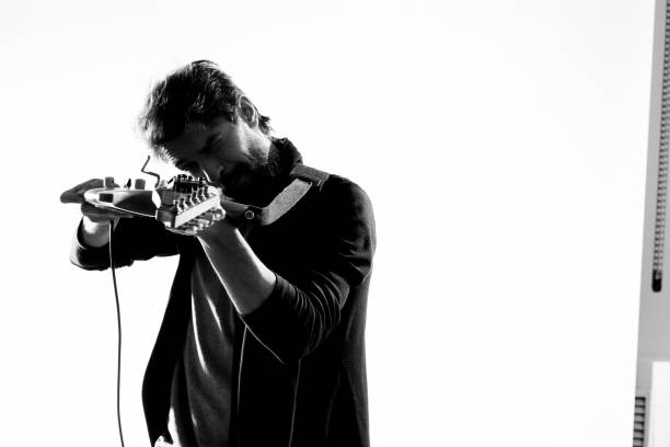 istock Male musician with guitar rock star performing entertainment program 2102512195
