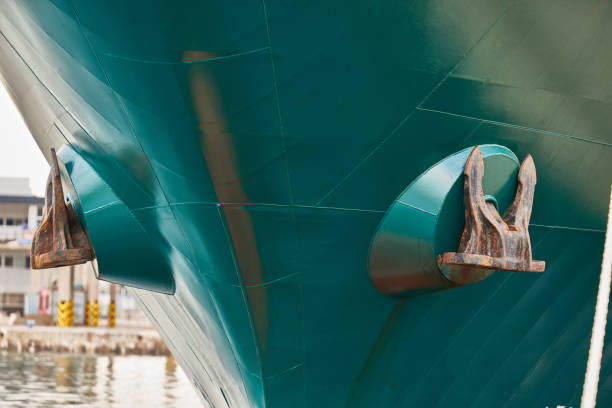 istock Rusty green boat anchors viewed from the front 2102515437