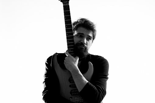 Male musician with guitar rock star performing entertainment program. High quality photo