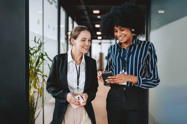 istock Employees walking down the company corridor 2102524452